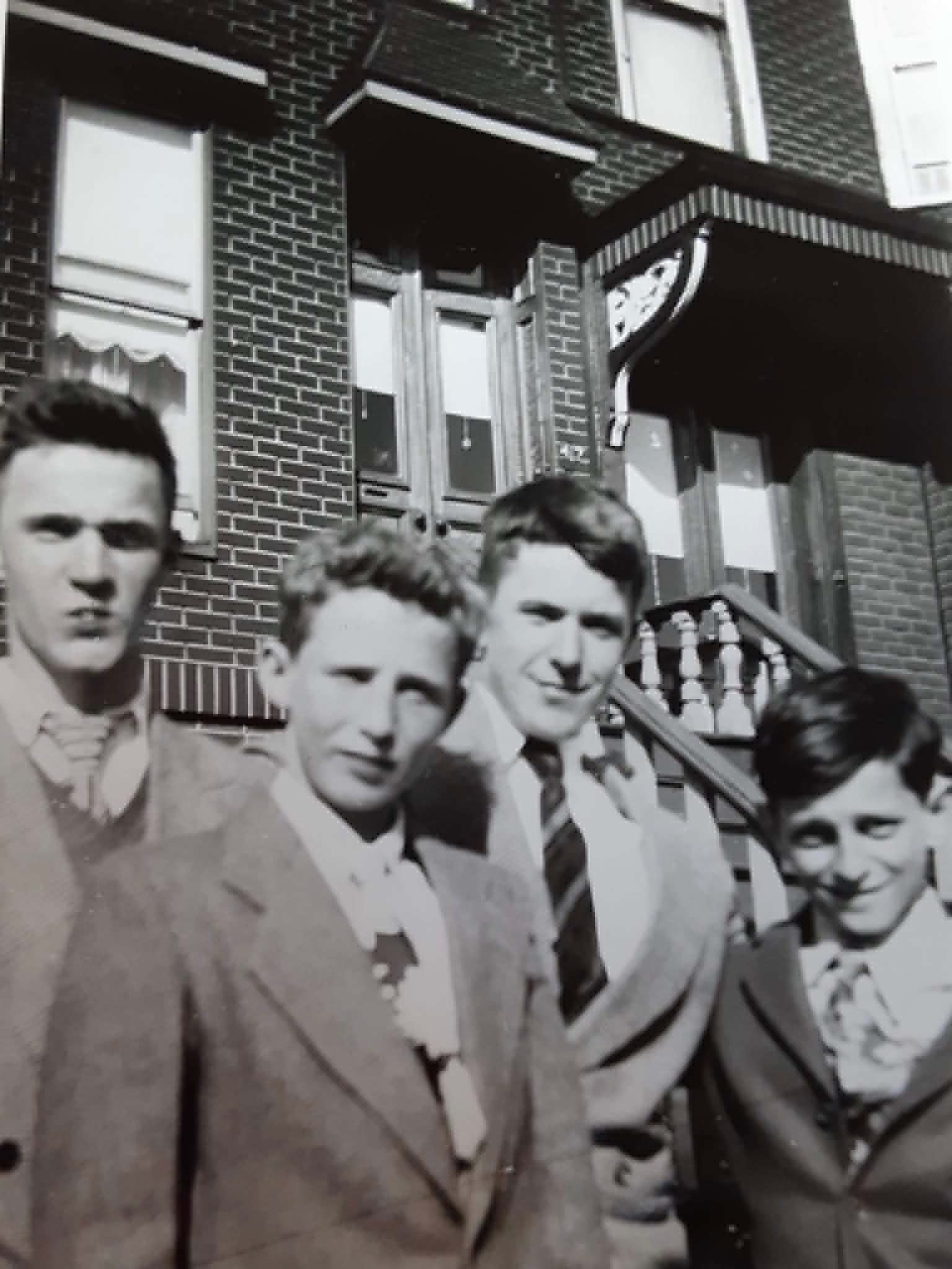 Boys of Windsor, 1948 — four young men in front of a Windsor Place row house.